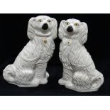 A Pair Of Staffordshire Pottery, White Seated Dogs