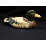A Carved & Painted Wooden Decoy Duck With Glass Eyes