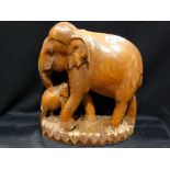 A 20th Century Carved Wooden Model Of An Elephant, 15" High