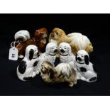 A Group Of Seven Mixed Pottery Model Dogs