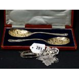 A Pair Of Cased Victorian Silver Plated Berry Spoons, Together With Three Decanter Labels, Including