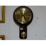 A Circular Dial Pendulum Wall Clock