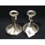A Pair Of Circular Based Silver Candle Holders