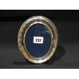 An Oval Silver Boardered Photograph Frame