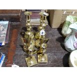 3 Pairs of Brass Candle Holders Together with A Pair of Brass Shoes