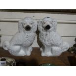 A Pair of Staffordshire Pottery White Seated Dogs