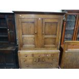 An Oak Linen Press Cupboard, The Upper Section Having Two Panelled Doors, 54 inches Wide