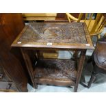 A Victorian Period Carved Two Tier Occasional Table with Portrait Top