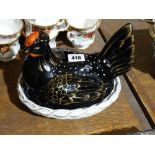 A Staffordshire Pottery Black And White Hen on Nest