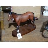 A Royal Doulton Chestnut Matt Finish Model Race Horse on A Wooden Plinth