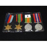 Four 2nd World War Service Medals to Include, War & Defence Medal, 39-45 Star & Pacific Star