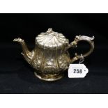 A Circular Based Silver Batchelors Tea Pot With Embossed Decoration, Hallmarks for Birmingham 1862