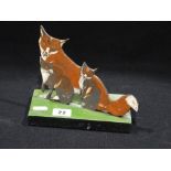 A Slate Door Stop With Painted Fox & Cubs Decoration