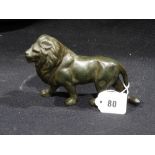 A Patinated Heavy Bronze Model Lion, 4" High