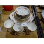 An Edwardian Floral & Gilt Decorated Tea Set, Together With A Small Quantity Of Circular Plates