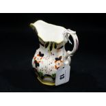 A 19th Century Panelled Staffordshire Pottery Cream Jug With Floral Decorated Body, 4" High
