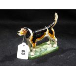 A Cold Painted Bronze Model Of A Fox Hound