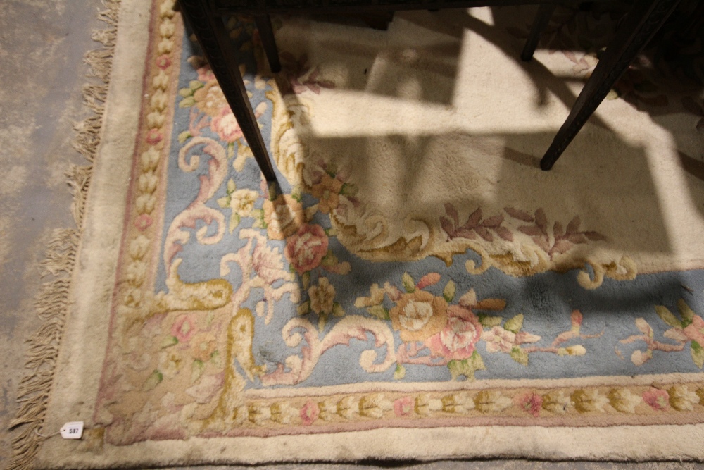 A Blue & Cream Ground Floral Decorated Woolen Floor Rug Approx 12ft X 9ft