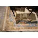 A Blue & Cream Ground Floral Decorated Woolen Floor Rug Approx 12ft X 9ft