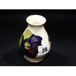 A Circular Based Cream Ground Moorcroft Bulbous Vase With Floral Decoration & Paper Label To The