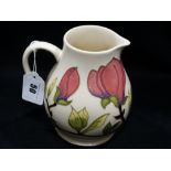 A Cream Ground Moorcroft Pottery Floral Decorated Milk Jug, 6" High