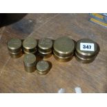 A Quantity Of Brass Bank Coin Scale Weights