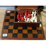 A Stained Bone Chess Set, Together With A Wooden Games Board