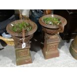 A Pair Of 20th Century Cast Metal Two Handled Flower Urns On Square Plinths, 21" High