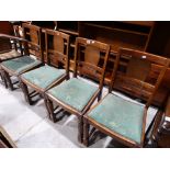 A Set Of Four Early 20th Century Polished Oak Dining Chairs