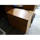 A Stripped Pine Bedding Chest With Sloping Lid