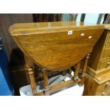 An Early 20th Century Polished Oak Gate Leg Table