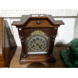 An Edwardian Oak Encased Mantel Clock With Silvered Dial