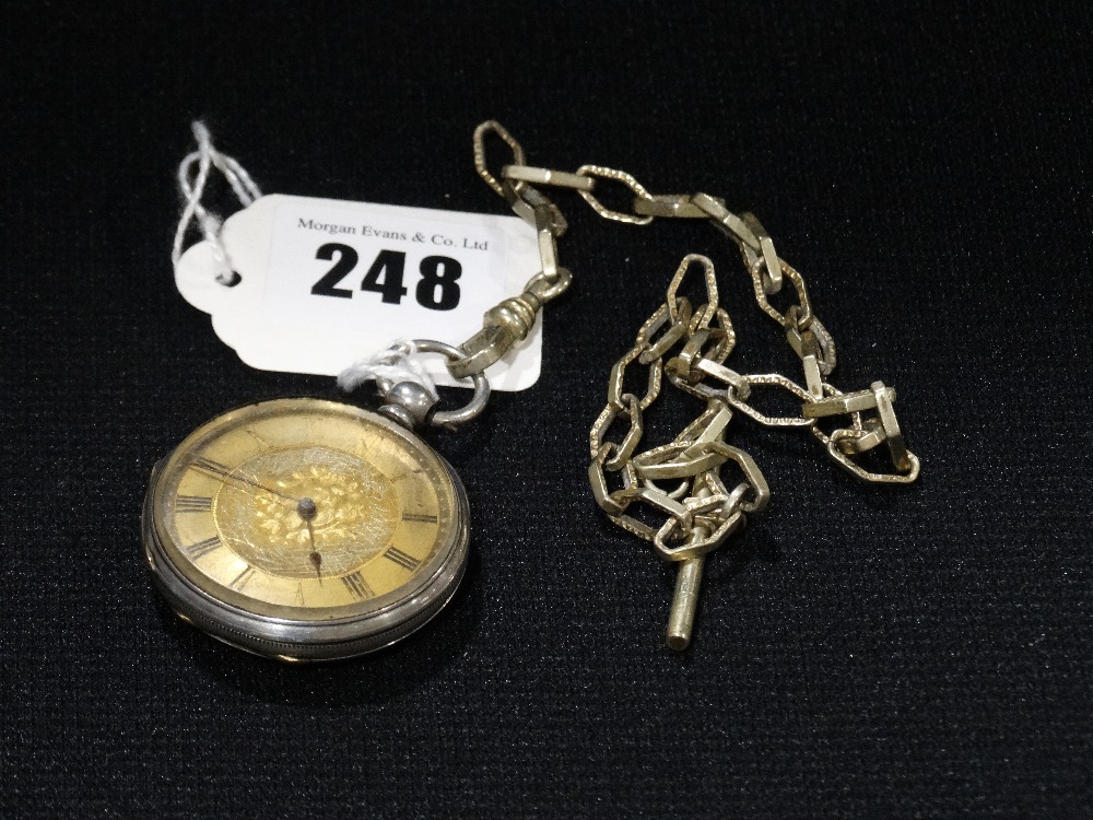 A Silver Encased Fob Watch On A White Metal Chain