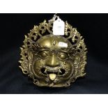 A Bronze Mask Of An Oriental Demon