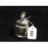 A Chrome Table Lighter In The Form Of An Oriental Figure