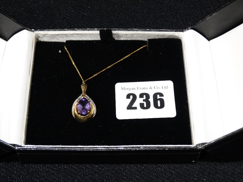 A 9ct Gold Diamond & Amethyst Pendant On A Gold Link Chain