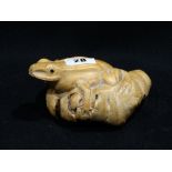 An Oriental Carving Of A Frog On A Toadstool