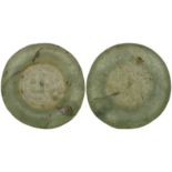 Fatimid, pale green glass weight, the three-line inscription apparently reading amir | al-Mu’ |