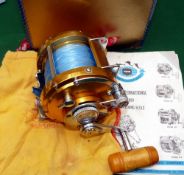 Penn International 50 big game multiplier reel: gold finish, lever drag with ratchet and power