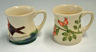 2x Moorcroft Pottery Mugs one marked 1993 with floral design the other with no date cipher