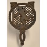Vic rugby/football cast iron stove trivet: comprising a skelton figure of rugby player kicking a