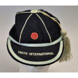 Youth International Cap with a Red Rose stitched to front and Youth International to peak in blue