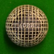 Rare Tom Morris guttie golf ball - line mesh pattern retaining much of the original white paint to