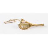 Gold Plated Tennis Racket and Pearl Ball Brooch measures 3.5cm approx. with pin to reverse and