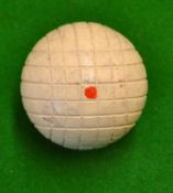 Scarce line cut wooden golf ball with red dots to both poles and retaining all the original white