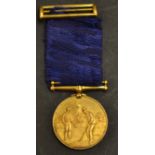 Fine gilt golfing medal and ribbon c.1900 - the obverse finely embossed with golfing figure, his