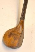 H Vardon scare head brassie golf club - with full wrap over sole plate and fitted with original hide