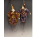 2x Oriental Wooden Puppets appear hand painted in traditional red and blue dress with sequin