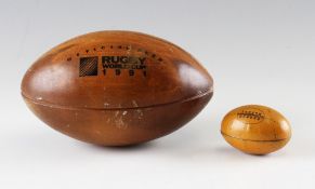 1991 New Zealand 'Steinlager' Rugby commemorative wooden ball and early tin plate rugby ball sweet