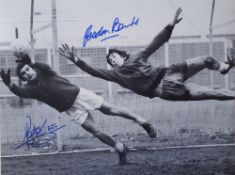 Peter Shilton and Gordon Banks Signed Football Print depicting both diving for the ball black and
